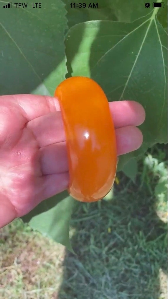 Bakelite orange swirl end of the day chunky bangl… - image 1