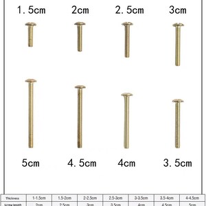 May include: Assortment of eight gold-colored screws with different lengths, ranging from 1.5 cm to 5 cm. The screws are arranged in four rows, with the length of each screw labeled in centimeters.