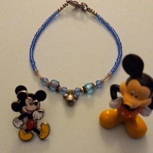 Vintage Disney&#39;s Mickey Mouse collectable bracelet, tin box, pin and figure
