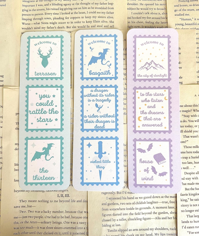 May include: Set of six fantasy-themed bookmarks with a postage stamp design. Each bookmark features a different illustration, including a stag, dragon, mountains, and text like "You could rattle the stars."