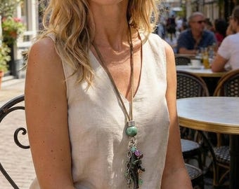 Fiva leather necklace with water buffalo horn fish