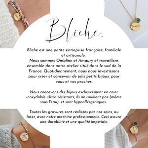 May include: A close-up of a product description for a French jewellery company called Bliche. The text describes the company as family-owned and handmade. The text also describes the jewellery as being made of stainless steel and hypoallergenic. The image also shows three pieces of jewellery: a gold necklace with a green stone and the name "Justine" on a tag, a gold bracelet with the name "Alice" on a tag, and a gold bracelet with the name "Alma" on a tag.