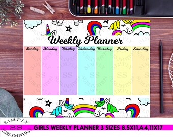 May include: A weekly planner with a unicorn and rainbow design. The planner has spaces for each day of the week, Sunday through Saturday. The planner is available in three sizes: 8.5x11 inches, A4, and 11x17 inches.