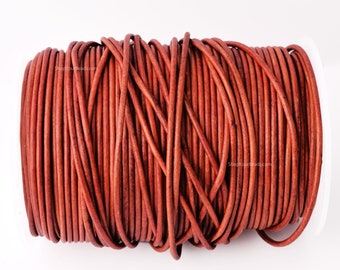 May include: A spool of brown leather cord, ideal for crafting jewellery or other projects.