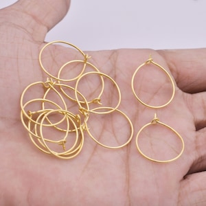 May include: A set of ten gold-toned hoop earrings. The hoops are small and delicate, and they are perfect for everyday wear.