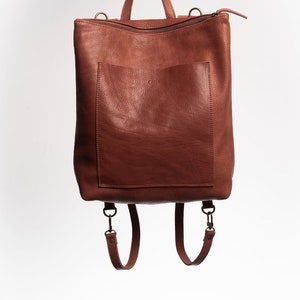 Full grain leather convertible backpack.