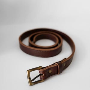A brown leather belt with a brass buckle. The belt is coiled and the buckle is facing the camera. Leather Belt - Leather Men Belt - Classic Leather Belt 35mm - Leather Women  Belt - Metal Buckle Leather Belt