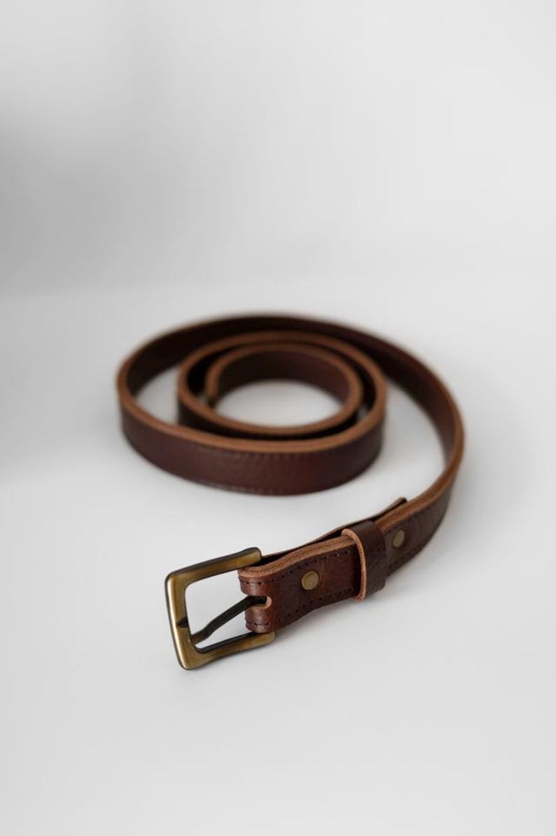 A brown leather belt with a brass buckle. The belt is coiled and the buckle is facing the camera. Leather Belt - Leather Men Belt - Classic Leather Belt 35mm - Leather Women  Belt - Metal Buckle Leather Belt