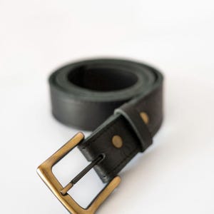 Leather Belt - Leather Men Belt - Classic Leather Belt 35mm - Leather Women  Belt - Metal Buckle Leather Belt - A black leather belt with a brass buckle. The belt is rolled up and the buckle is facing the camera.
