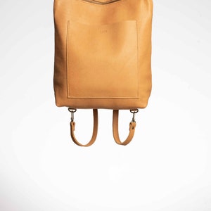 Full grain leather convertible backpack.