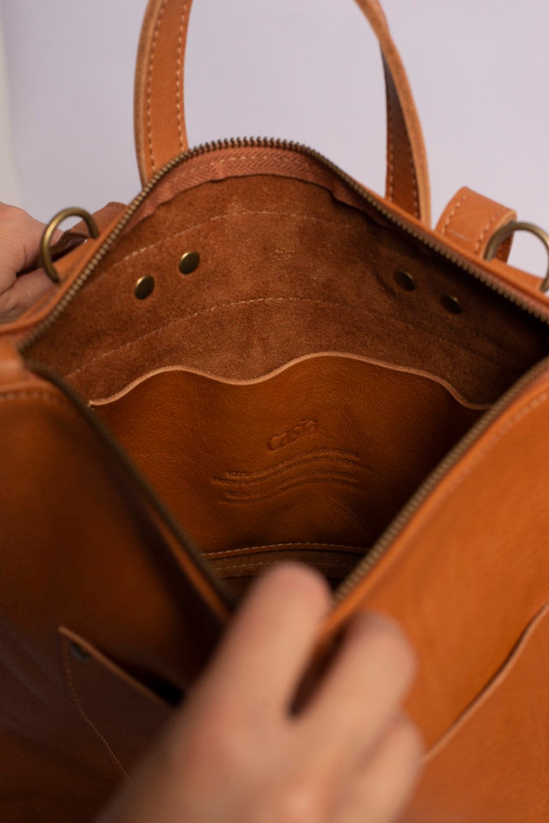 Full grain leather convertible backpack.