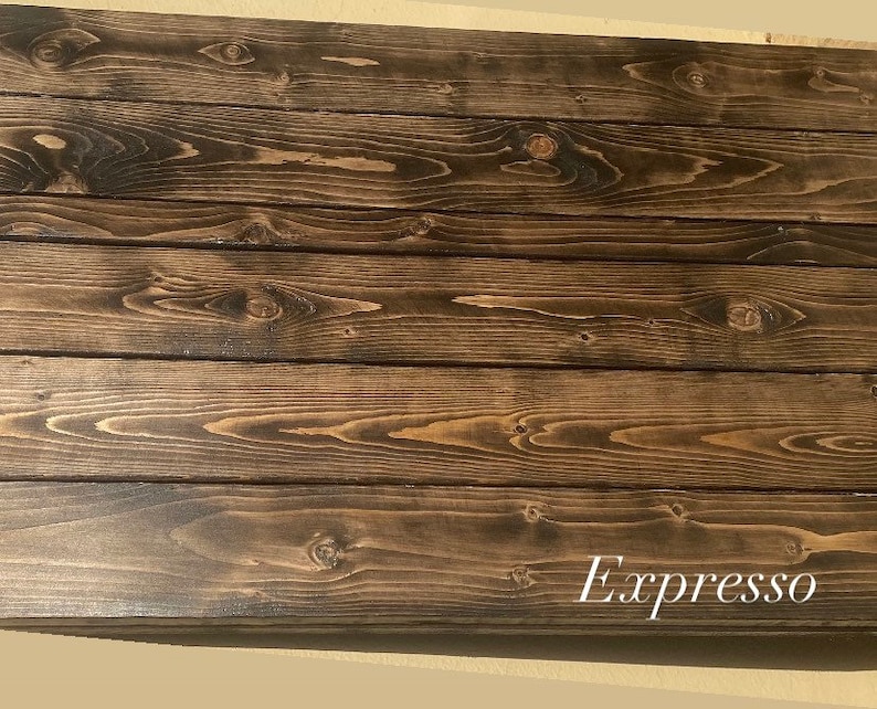 May include: Close-up of a dark brown wood surface with a natural wood grain pattern. The wood has a smooth, polished finish. The text "Espresso" is written in white on the bottom right corner of the image.