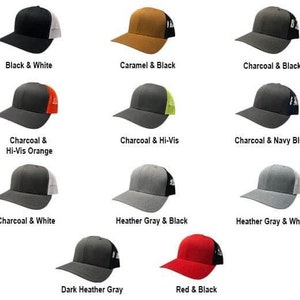 May include: A collection of trucker hats in various colors, including black and white, caramel and black, charcoal and black, charcoal and hi-vis orange, charcoal and hi-vis, charcoal and navy blue, charcoal and white, heather gray and black, heather gray and white, dark heather gray, and red and black.