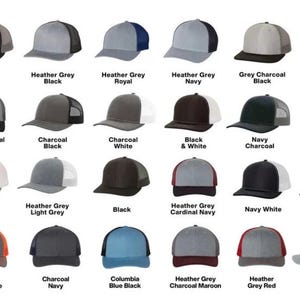 May include: A collection of baseball caps in various colors, including black, grey, navy, and red. Each cap features a mesh back and a curved brim. The image displays the different color options available, with text labels identifying each color combination.