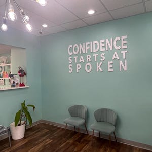 Custom laser-cut wooden business logo sign with elegant raised 3D lettering, perfect for a medspa, combining natural wood texture with a polished finish to create a welcoming and professional atmosphere.
