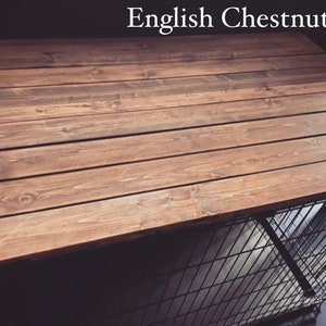 May include: A wooden top for a dog crate, stained in a dark brown color called "English Chestnut". The wood is arranged in horizontal planks.