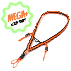 May include: A lanyard crafted from braided orange and black cord, featuring a black plastic buckle, a small metal atom-shaped charm, and two orange cord loops. A green starburst graphic in the upper left corner displays the text MEGA+ HEAVY DUTY.
