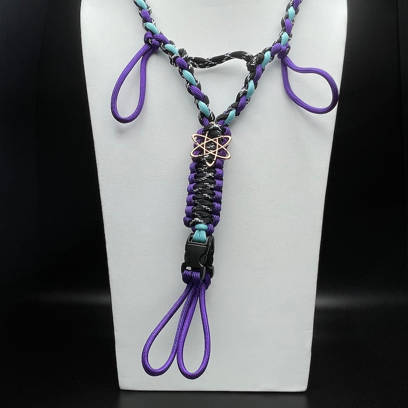 Dark Knight/Acid Purple/Glow Turquoise with Rose Gold atom charm  (Knight and Glow colors are “premium”)