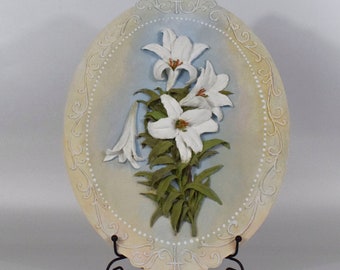 Relief painting White lilies on an oval wooden board