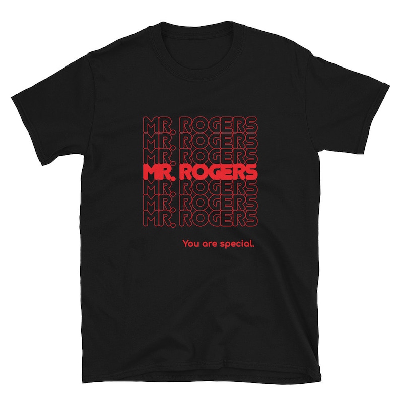May include: Black t-shirt with a red graphic print of the phrase "MR. ROGERS" repeated multiple times. The text "You are special." is printed below the graphic.