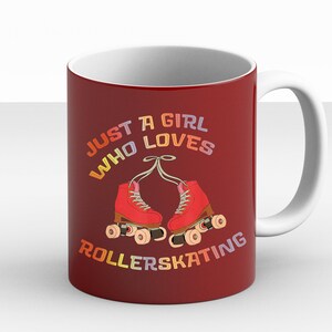 May include: Red coffee mug with a white interior and handle. The mug features a graphic of roller skates with the text "Just a girl who loves rollerskating" in rainbow colors.