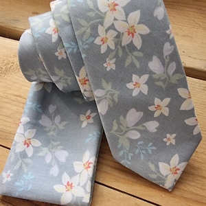 Tie and Hanks patterned set in a soft blue grey wedding ties.