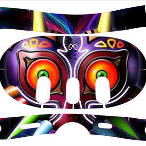 May include: A colorful video game console skin featuring a purple, red, and yellow design with a large, menacing face. The skin is designed to fit a video game console and includes a QR code that says "Scan for application tutorial video!"
