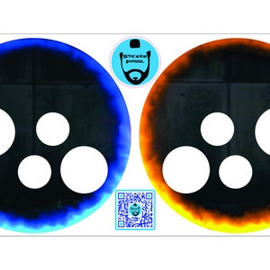 May include: Two round black and white decals with a blue and orange flame design. The decals have five white circles cut out of the black center.