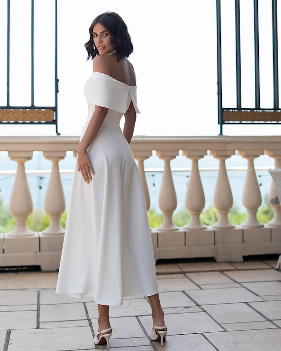 White Off-Shoulder Midi Bridal Dress with Corset Bodice and Full Skirt | Elegant Civil Wedding or Courthouse Ceremony Look White Off-Shoulder Midi Bridal Dress with Corset Bodice and Full Skirt | Elegant Civil Wedding or Courthouse Ceremony Look