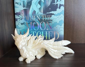 White dragon moonplume when the moon hatched inspired 3d printed decor for bookshelf