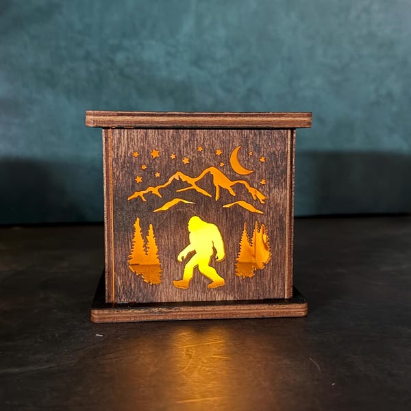 Rustic sasquatch Bigfoot in mountains Luminary flamless candle box shelf decor remote caddy pen holder