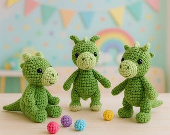 May include: Three handmade green crochet dragon toys with black eyes and small horns. One dragon is sitting, and two are standing. Colorful balls in pink, purple, blue, and yellow are in front of the dragons. A pastel rainbow and banner are in the background.