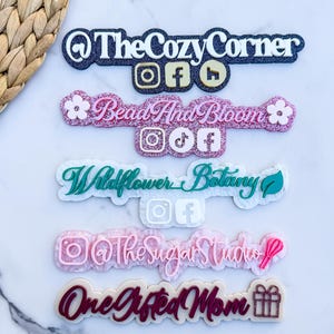 May include: Several acrylic business logos with social media icons. The logos include "The Cozy Corner," "Bead And Bloom," "Wildflower Botany," "@The Sugar Studio," and "One Gifted Mom." Each logo has a unique color scheme and design.