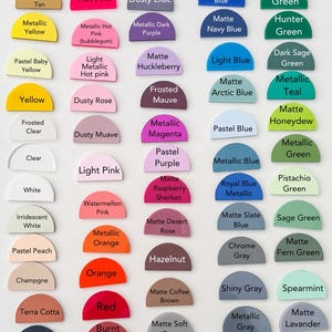 May include: A colour chart displaying a range of hues, each labelled with its name. Colours include matte and metallic finishes, with shades of pink, blue, green, and grey. The chart is arranged in rows and columns, presenting a wide spectrum of colours.