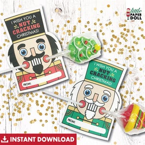 May include: Two printable nutcracker lollipop gift tags with the text "I wish you a nut cracking Christmas!" and a space to write "From:". The tags are designed to be attached to lollipops.