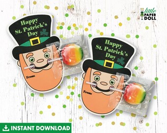 May include: Printable St. Patrick's Day lollipop treat bag with a cartoon leprechaun wearing a green hat and holding a lollipop. The text on the bag says "Happy St. Patrick's Day".