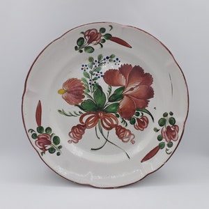 Old round plate, Eastern earthenware, St Clément, decoration of forget-me-nots, old rose and ribbon, flowering branches, late 18th-early 19th century