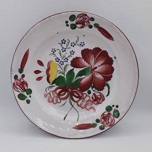Old round plate, Eastern earthenware, St Clément, decoration of forget-me-nots, old rose and ribbon, flowering branches, late 18th-early 19th century