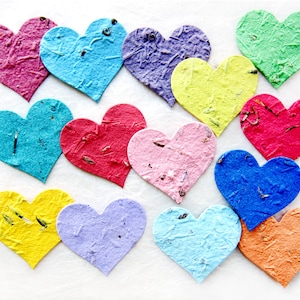 assorted two inch flower seed paper hearts shown in rainbow colors