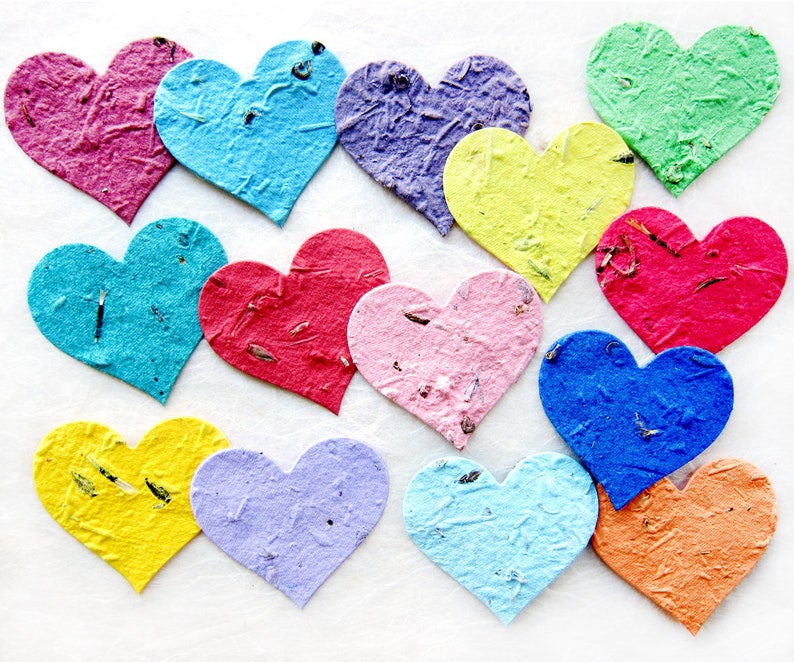 assorted two inch flower seed paper hearts shown in rainbow colors