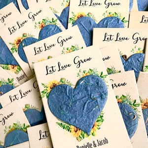 Recuerdos de boda con girasoles de papel con semillas de flores de color azul marino - Tarjetas personalizadas "El amor crece"