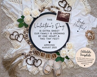 May include: A Valentine's Day pregnancy announcement with a black and white sign that reads "This Valentine's Day is extra sweet, our family is growing by one heart & two tiny feet! Arriving August 2025". The sign is surrounded by white roses, wooden beads, and a baby onesie that reads "Baby Hartford".