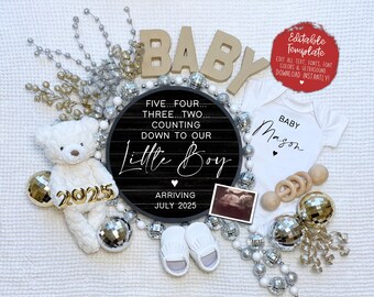 May include: A black and white chalkboard sign with the text "Five...Four...Three...Two...Counting Down To Our Little Boy" and "Arriving July 2025". A white onesie with the text "Baby Mason" is next to the sign. The sign and onesie are surrounded by silver and gold decorative items.