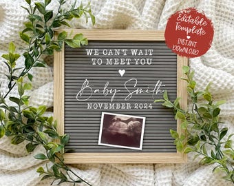 May include: A gray letter board with white letters announcing "We can't wait to meet you Baby Smith November 2024". A small white heart is above the name and a black and white ultrasound image is below the date.