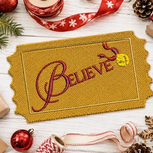 May include: A rectangular gold-colored embroidered patch shaped like a ticket with scalloped edges. The word "Believe" is stitched in a dark red cursive font across the center, accompanied by a small yellow embroidered bell with a red ribbon.