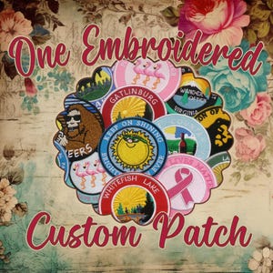 May include: A collection of colorful embroidered patches featuring various designs, including a sun, a bear, a flamingo, and a heart. The patches are arranged in a circle and surrounded by a floral pattern. The text "One Embroidered Custom Patch" is written in large, bold letters at the top and bottom of the image.