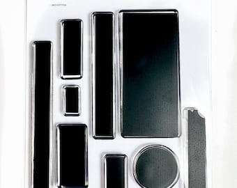 May include: A clear sheet of transparent stamps with various shapes and sizes. The stamps are black and feature rectangular, square, circular, and oval shapes. The sheet is labeled "Craftily By Toni" and "W01071708".