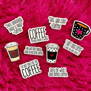 May include: A set of nine coffee-themed stickers with various sayings and designs. The stickers feature black and white illustrations of coffee cups and mugs, with some featuring red hearts. The sayings on the stickers include "Does somebody need a mug?", "Coffee because murder is wrong", "You will start making sense to me after coffee", "I'm just here for the coffee", "Yes, you can! Coffee", "I don't need coffee (said no one ever)", and "Sorry for what I said before coffee."