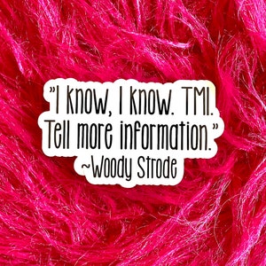 May include: A white sticker with the quote "I know, I know. TMI. Tell more information." attributed to Woody Strode, set against a vibrant pink, fluffy background.