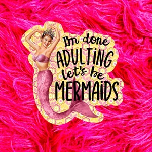 May include: A pink and yellow sticker with a mermaid illustration and the text "I'm done adulting let's be mermaids".